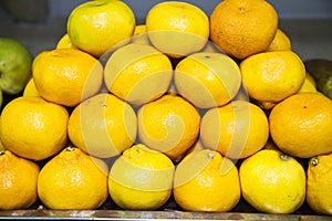 The fruits of Mandarin Latin CÃÂ«trus reticulÃÂta are yellow in color, folded into a pyramid. Fruits nuts vegetables berries photo